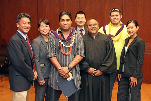 Two DWI Court graduates with judge and others.