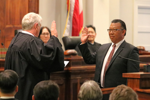 Chief Justice Mark E. Recktenwald administers the oath of office to Derrick Chan,  Hawaii's newly appointed Intermediate Courts of Appeal associate judge.