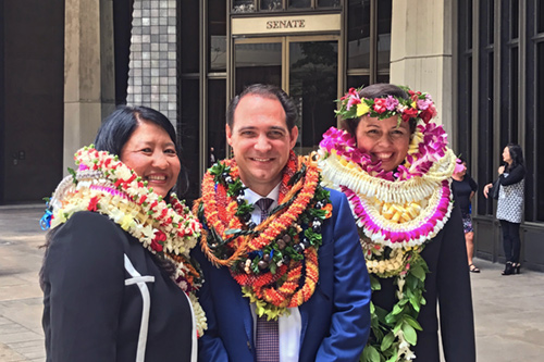 A group photograph of Darolyn Lendio Hein, Brian Costa, and Trish Morikawa after their Senate Confirmation hearing.