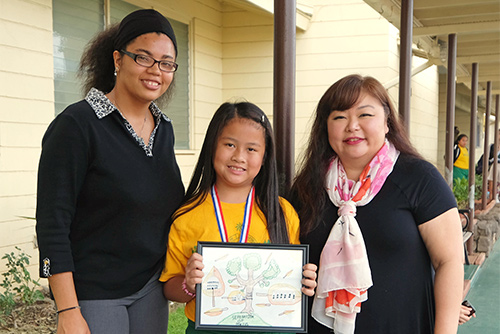 A picture of one of the winners of the First Circuit Court's 2018 Poster Contest from St. John the Baptist Catholic Schoos