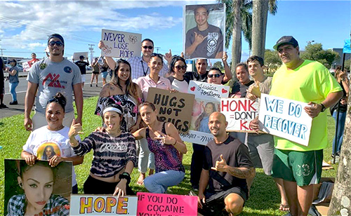 Hilo Drug Court volunteers at the 05/15/19 National Drug Court Month “Drug Abuse and Suicide Prevention Sign Waving” event.