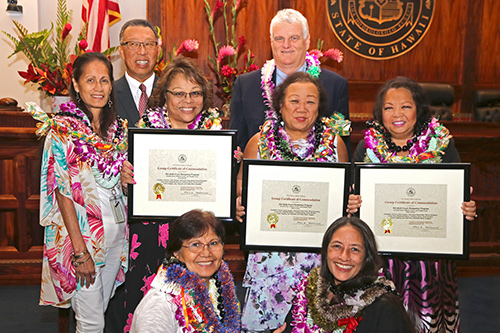 First Circuit (Oahu) Ho'okele Court Navigation Program representatives Sonia Soriano, Jonina Tagalog, GloriJean Kamealoha, Adele Tangjian, Grace Ono, and Elizabeth Ramirez, with Intermediate Court of Appeals Associate Judge Derrick H.M. Chan and Hawaii Supreme Court Chief Justice Mark E. Recktenwald, in the Supreme Court courtroom, 09/30/2019.