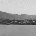 1885 photo from the ocean. View of shoreline with Aliiolani Hale on left and Kawaiahao Church on the right.