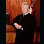 First Circuit Chief Judge R. Mark Browning, standing in front of the courtroom bench.