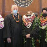 From left: Judge Clarissa Y. Malinao, Chief Justice Mark E. Recktenwald, Judge Shanlyn A.S. Park, and Judge Kevin T. Morikone stand together in front of the Hawaii Supreme Court bench, 12/16/2021.